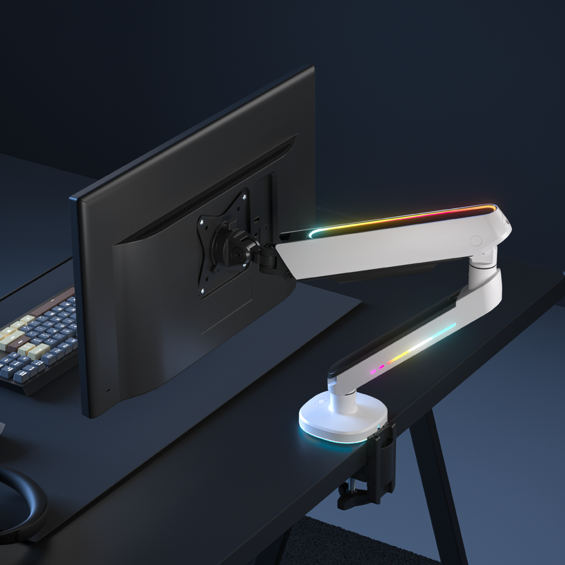 A single monitor arm with RGB lighting, attached to a desk and holding a monitor, with a keyboard and mouse in the background.